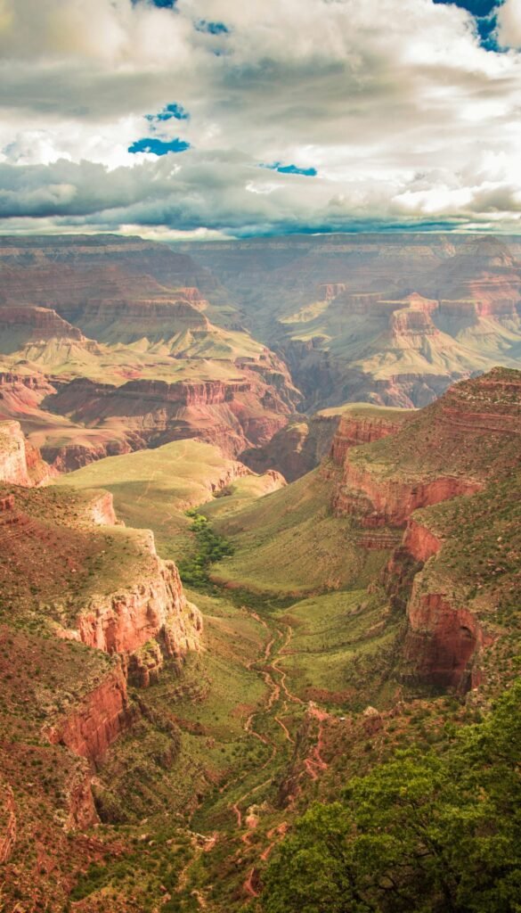 Breathtaking panoramic view of the Grand Canyon under dramatic skies.