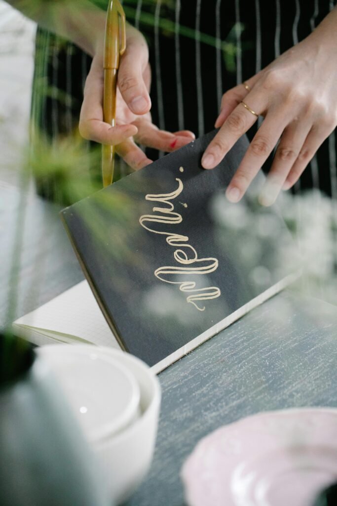 Close-up of hands holding a black menu, suitable for restaurant or culinary themes. Menu planning meal planning