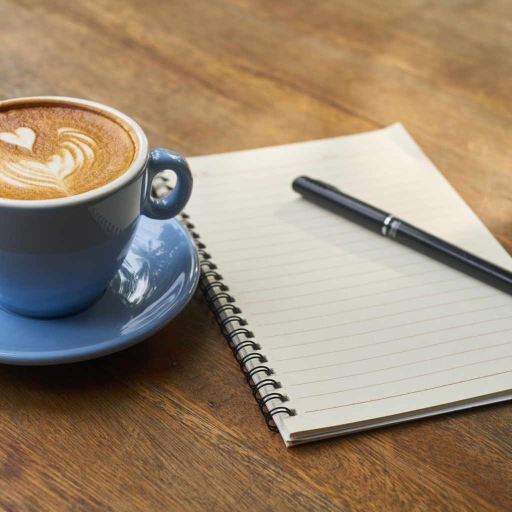 notebook and coffee plan